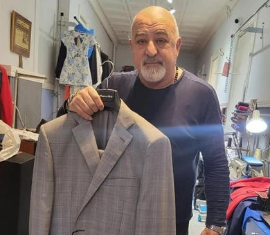 Gregory Chobanian working at the sewing machine